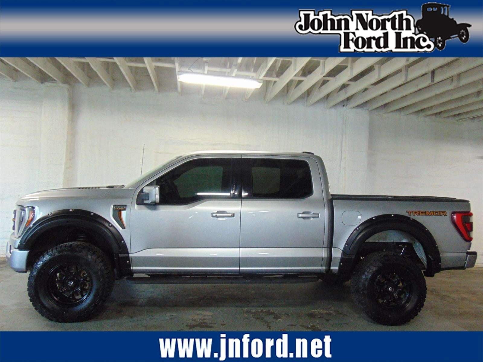 2022 Ford F-150 Tremor in Iconic Silver (Js) — front three-quarter view