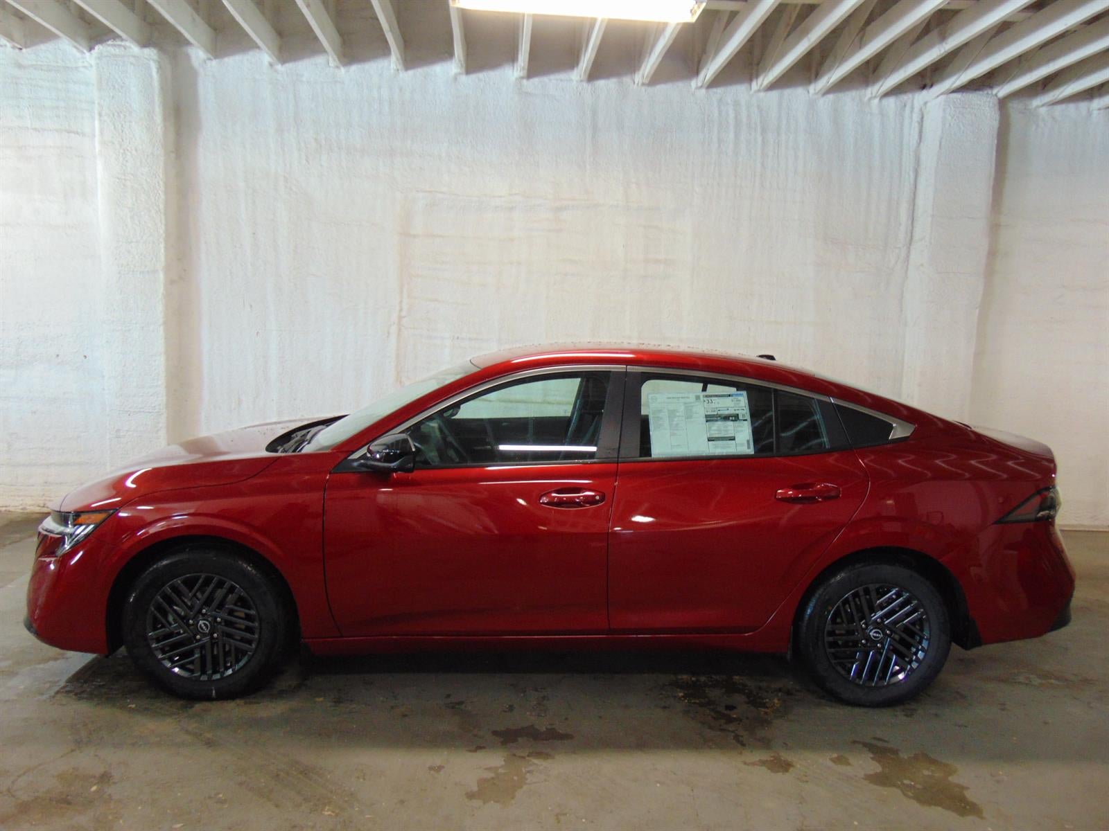 2026 Nissan Sentra SV SEDAN in Charcoal I/Scarlet Em — front three-quarter view